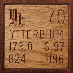 Wooden tile representing the elementYtterbium