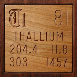 Wooden tile representing the elementThallium
