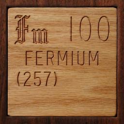 Wooden tile representing the elementFermium