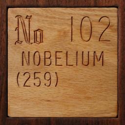 Wooden tile representing the elementNobelium